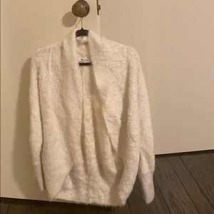 Fuzzy cream sweater. Barely works.